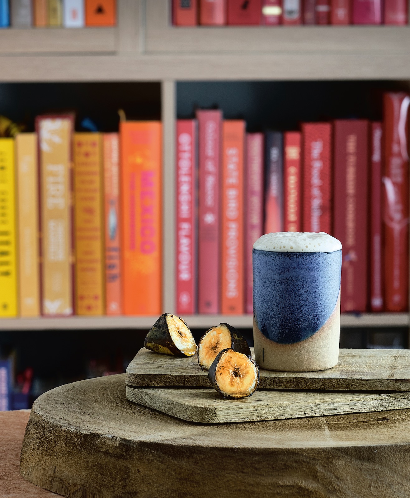 Delicious-looking cocktail in front of a bookshelf