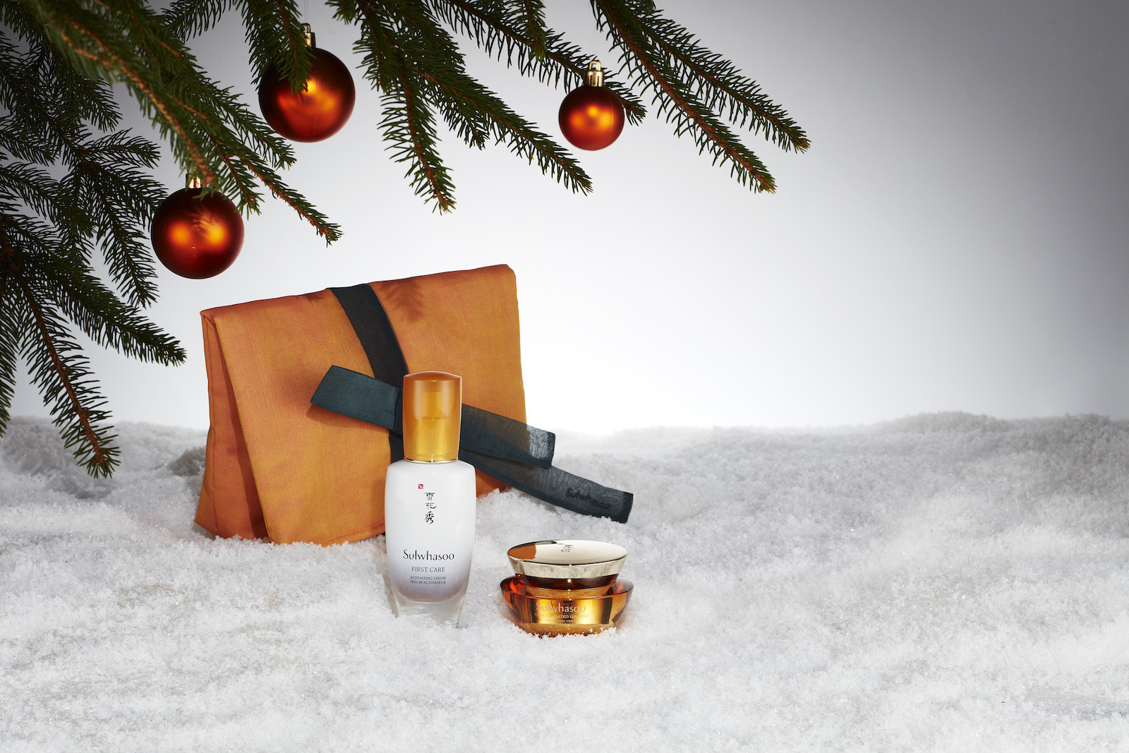 Skin care products under a Christmas tree