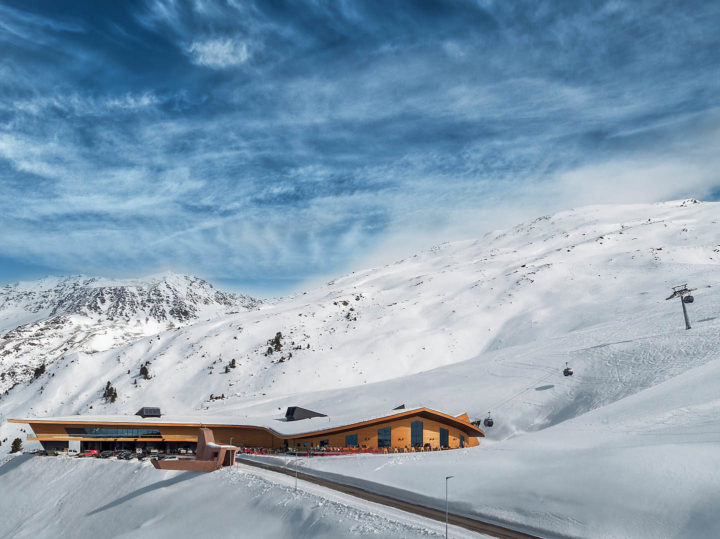 Building surrounded by snowy mountain