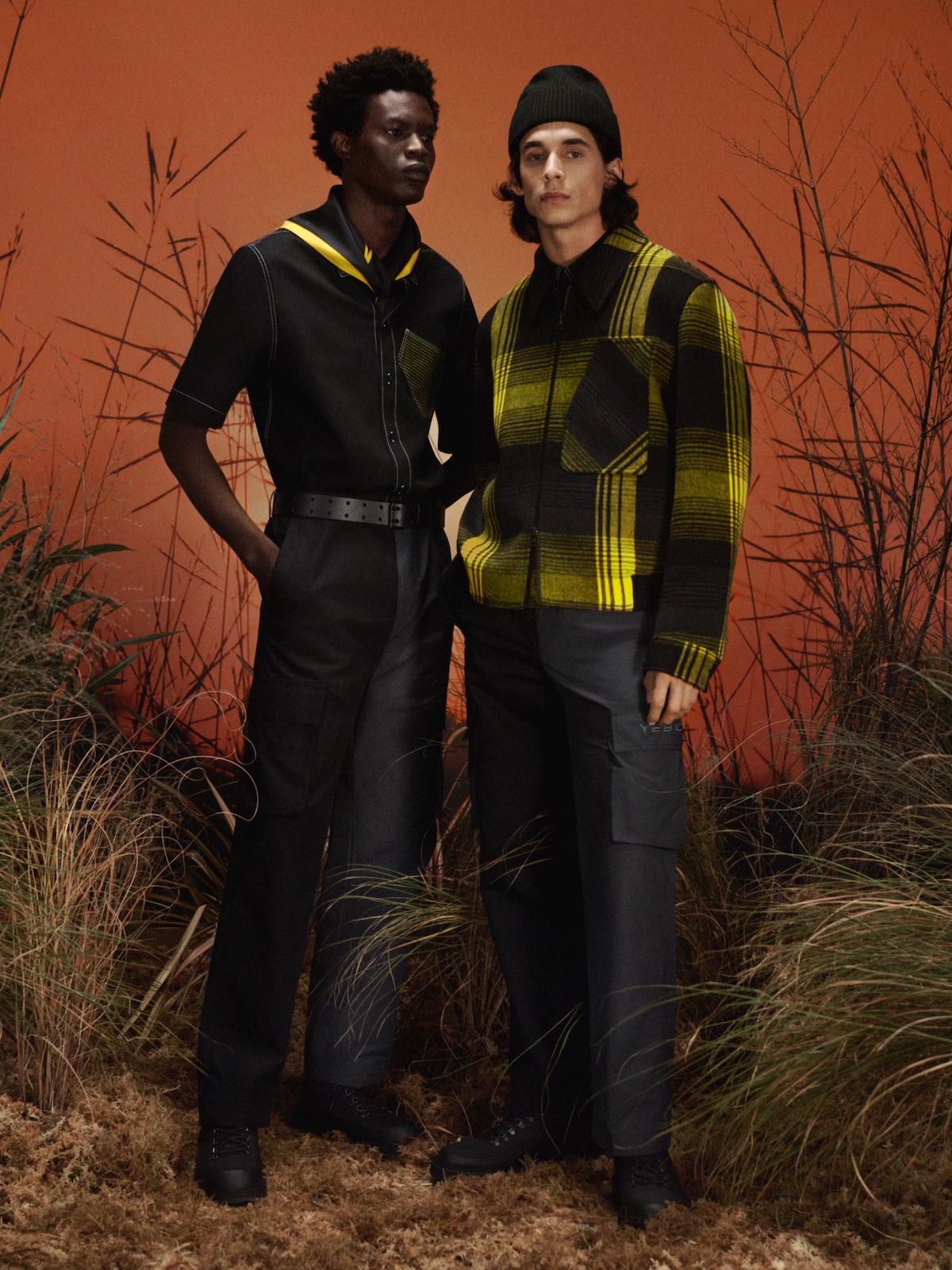 Two people wearing pieces from the limited-edition clothing collection