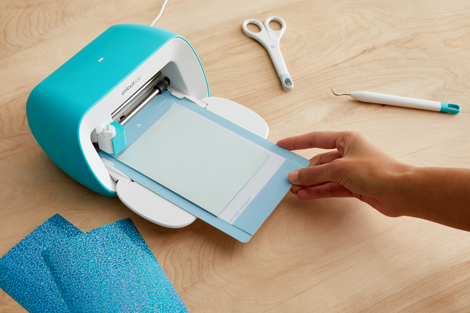 Cutting machine with paper being fed into it