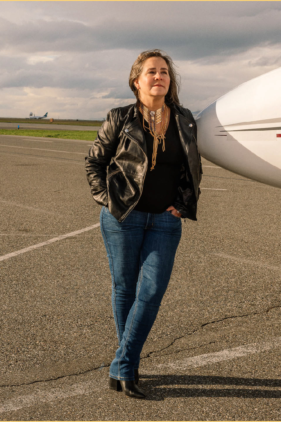 Teara Fraser leans against plane