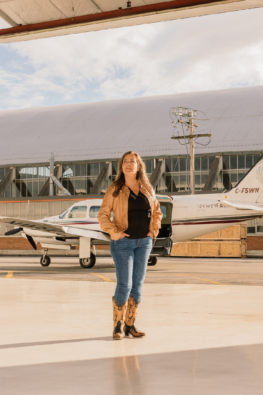 Teara Fraser standing outside plane