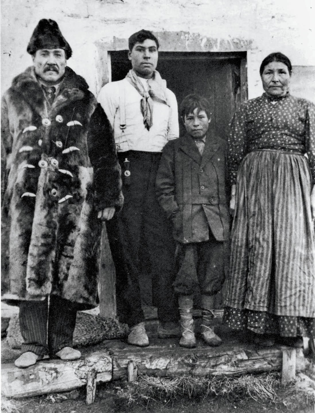 Ewan Moberly family in front of their house in Grande Cache. [1912] Pa 20-29. Photo courtesy of Jasper-Yellowhead Museum And Archives.