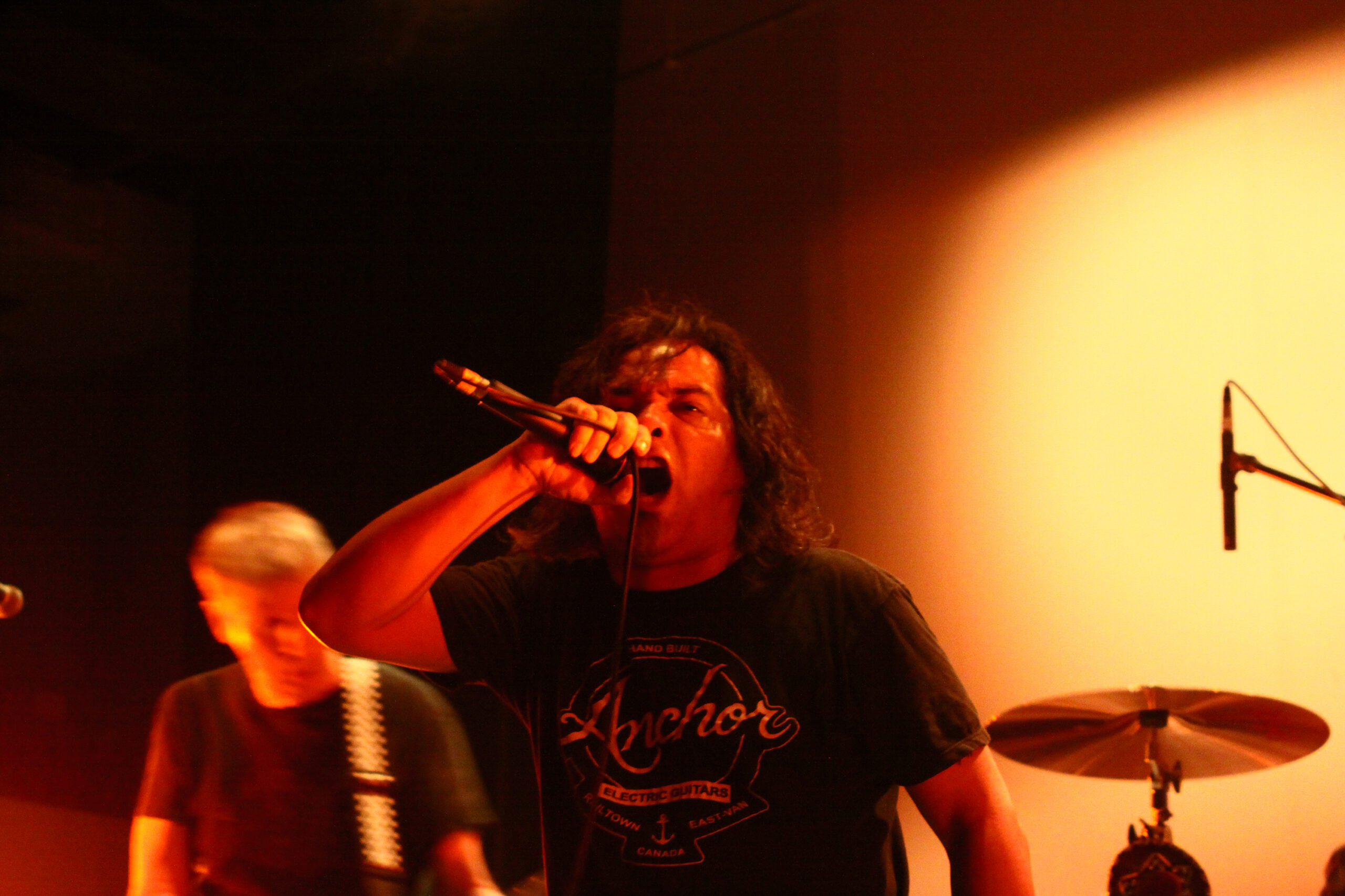 Ron Reyes performing onstage with Black Flag.