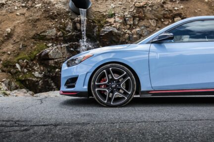 The front of a blue Hyundai Veloster N.