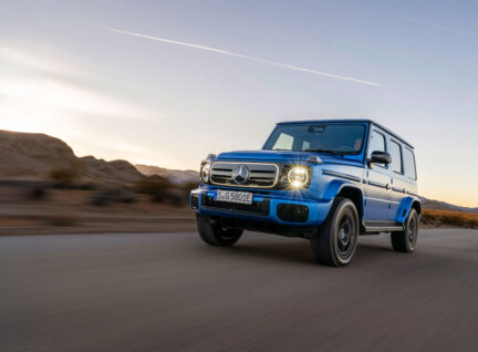 A blue Mercedes-Benz G-class on a road