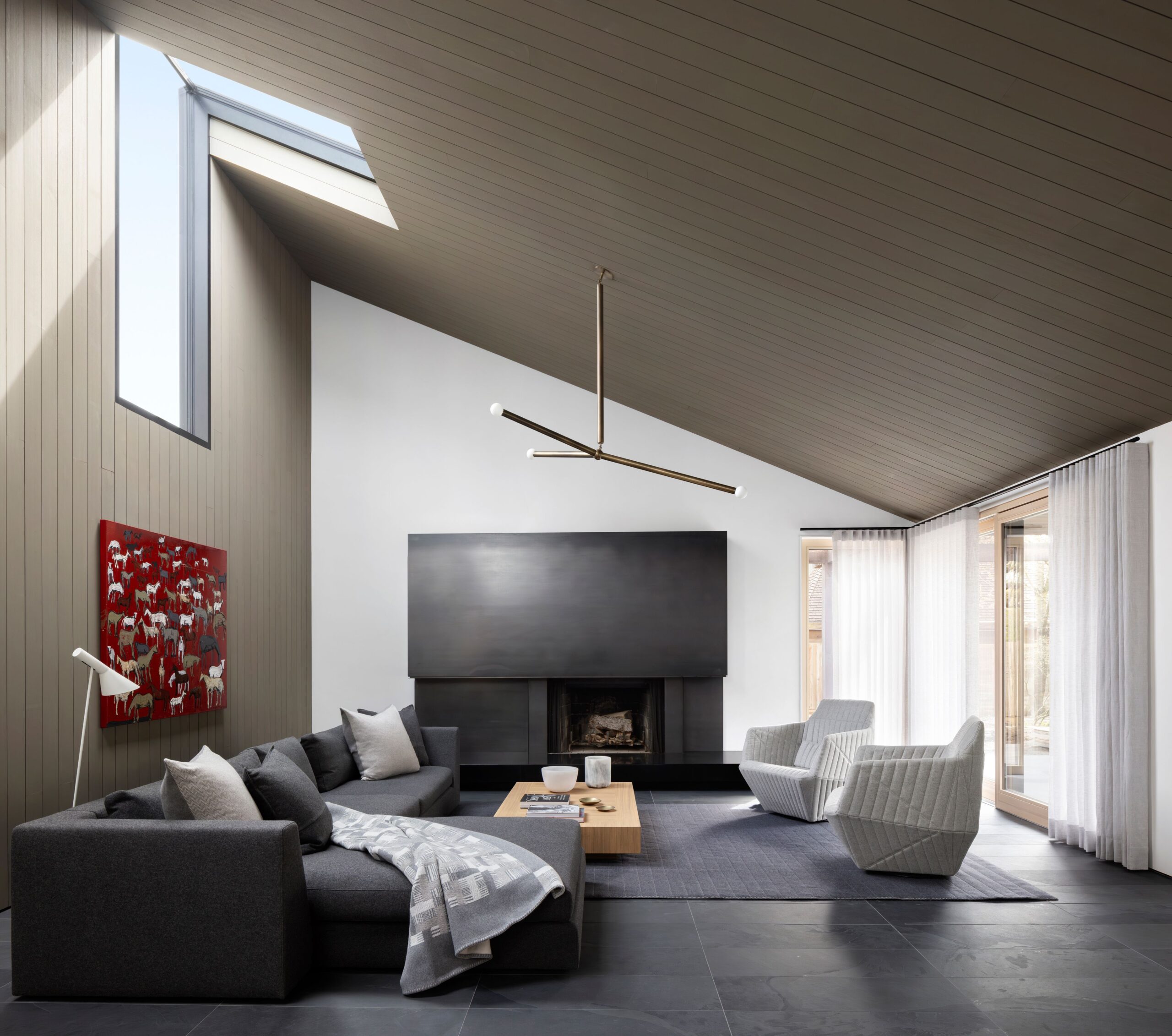 The interior (living room with furniture) of Measured Architecture's Paddock House.