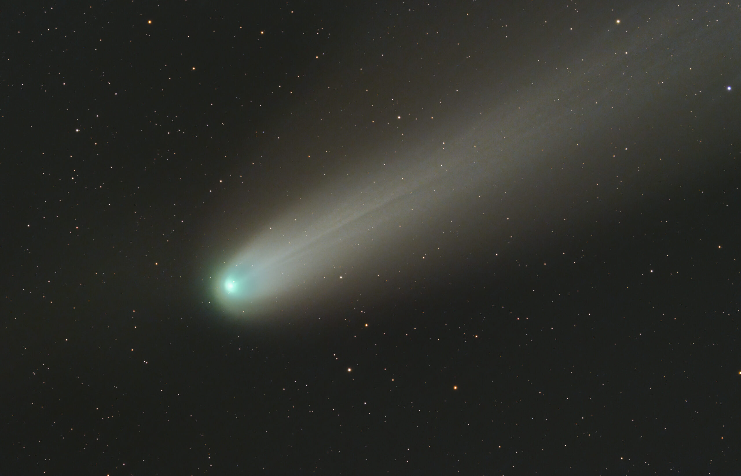 A comet flying through the night sky.