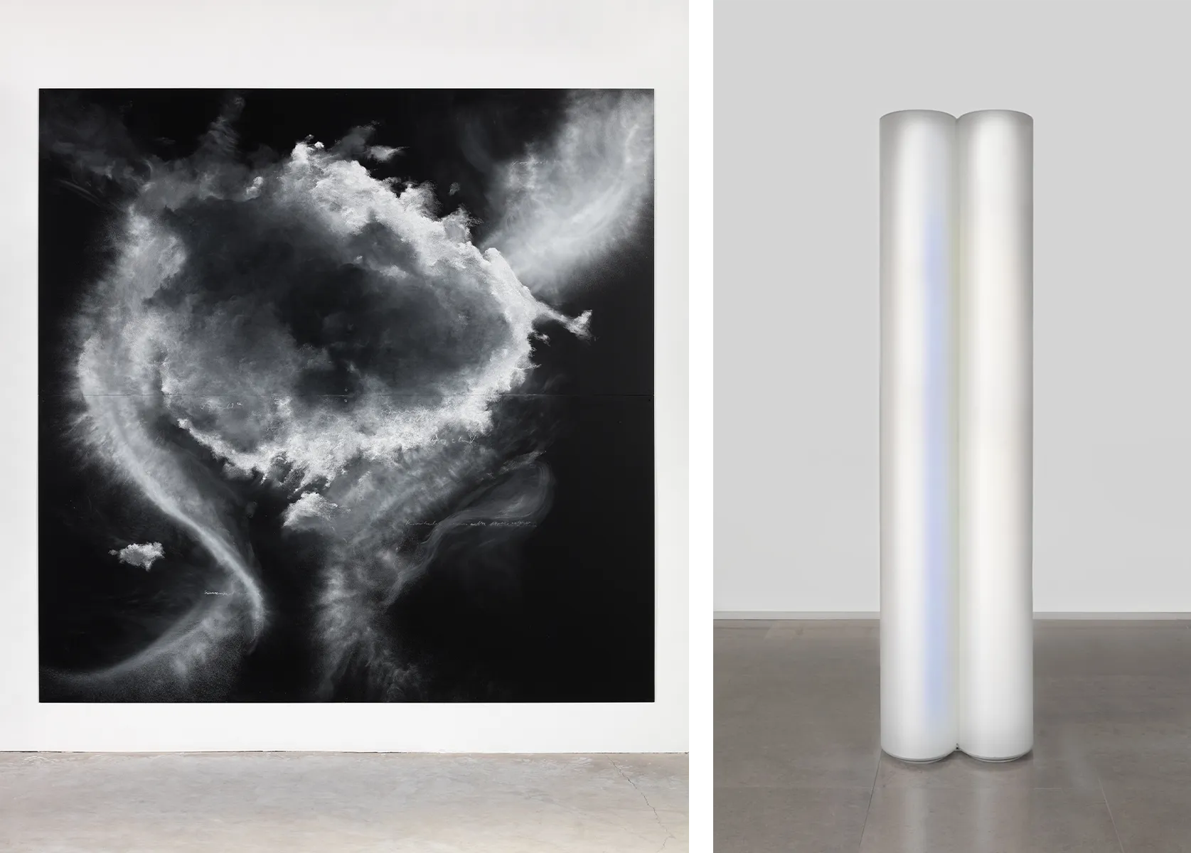 Two works of art side by side. On the left is an abstract black and white image. On the right, a white, vertical sculpture.