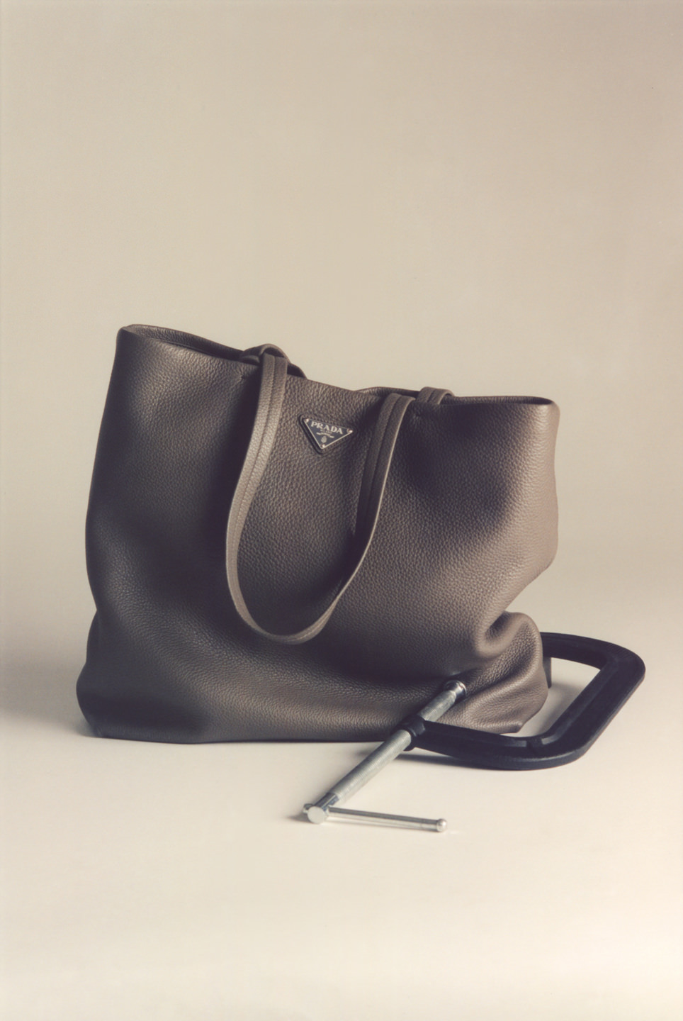 Men's fashion accessories: a charcoal leather satchel.
