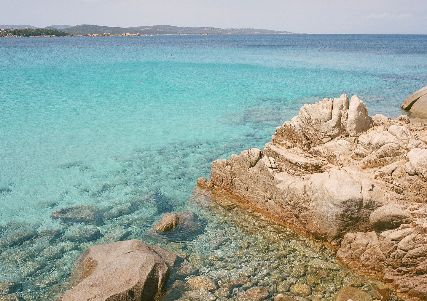 Bright blue water on a mediterranean beach.