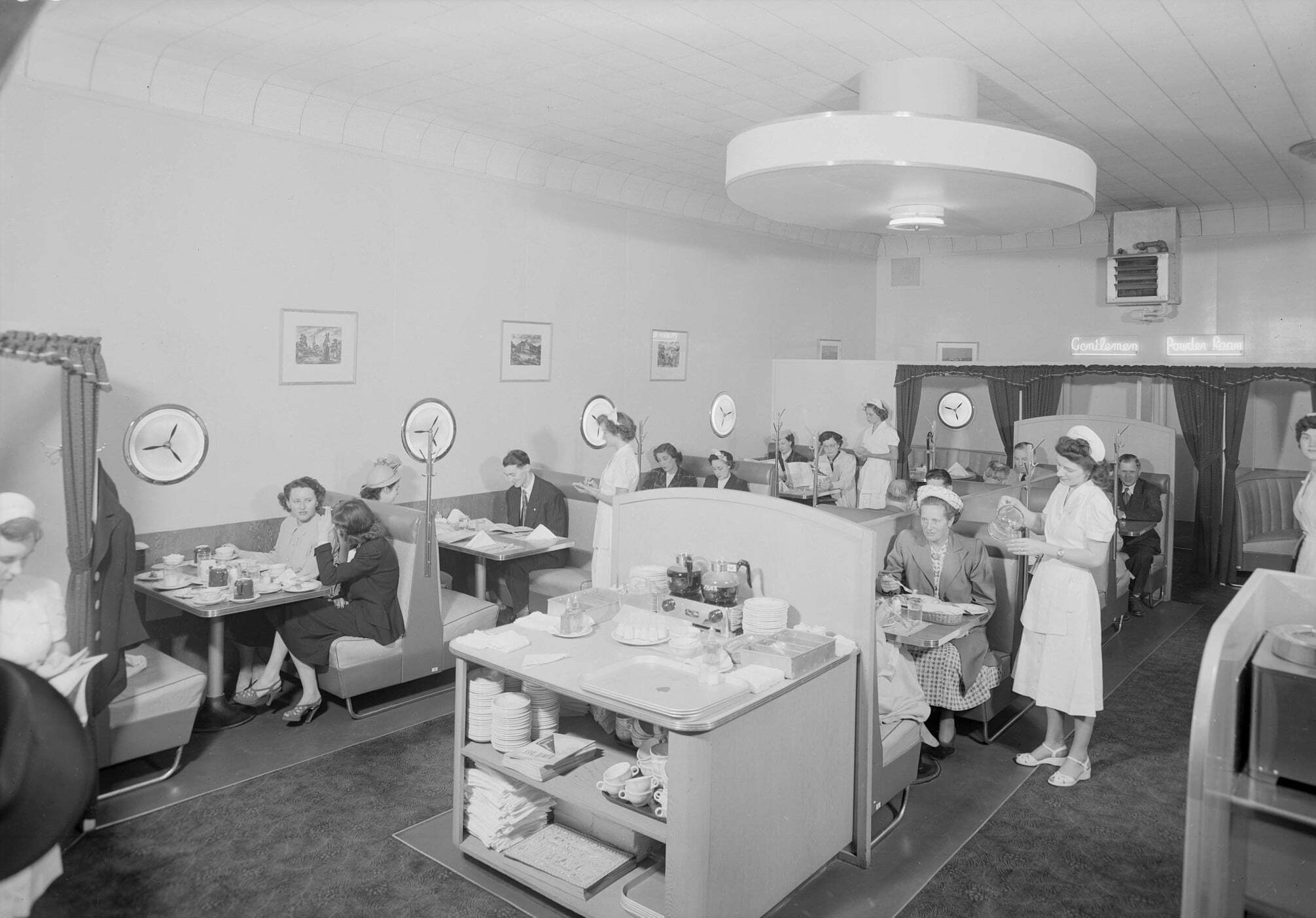 The interior of the Sky Diner: Patrons sit in rounded restaurant booths.