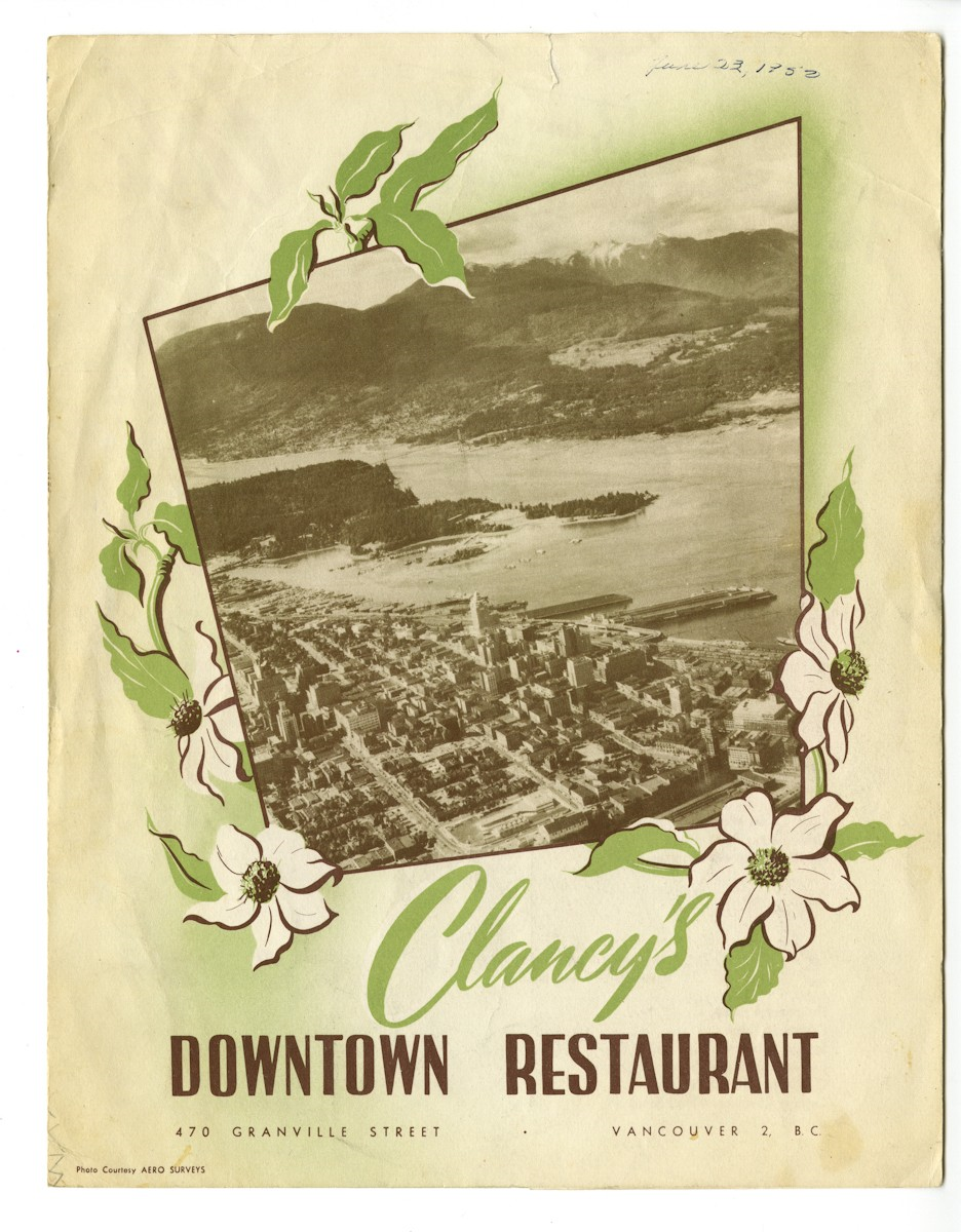 A restaurant menu featuring a photo of Vancouver from above.