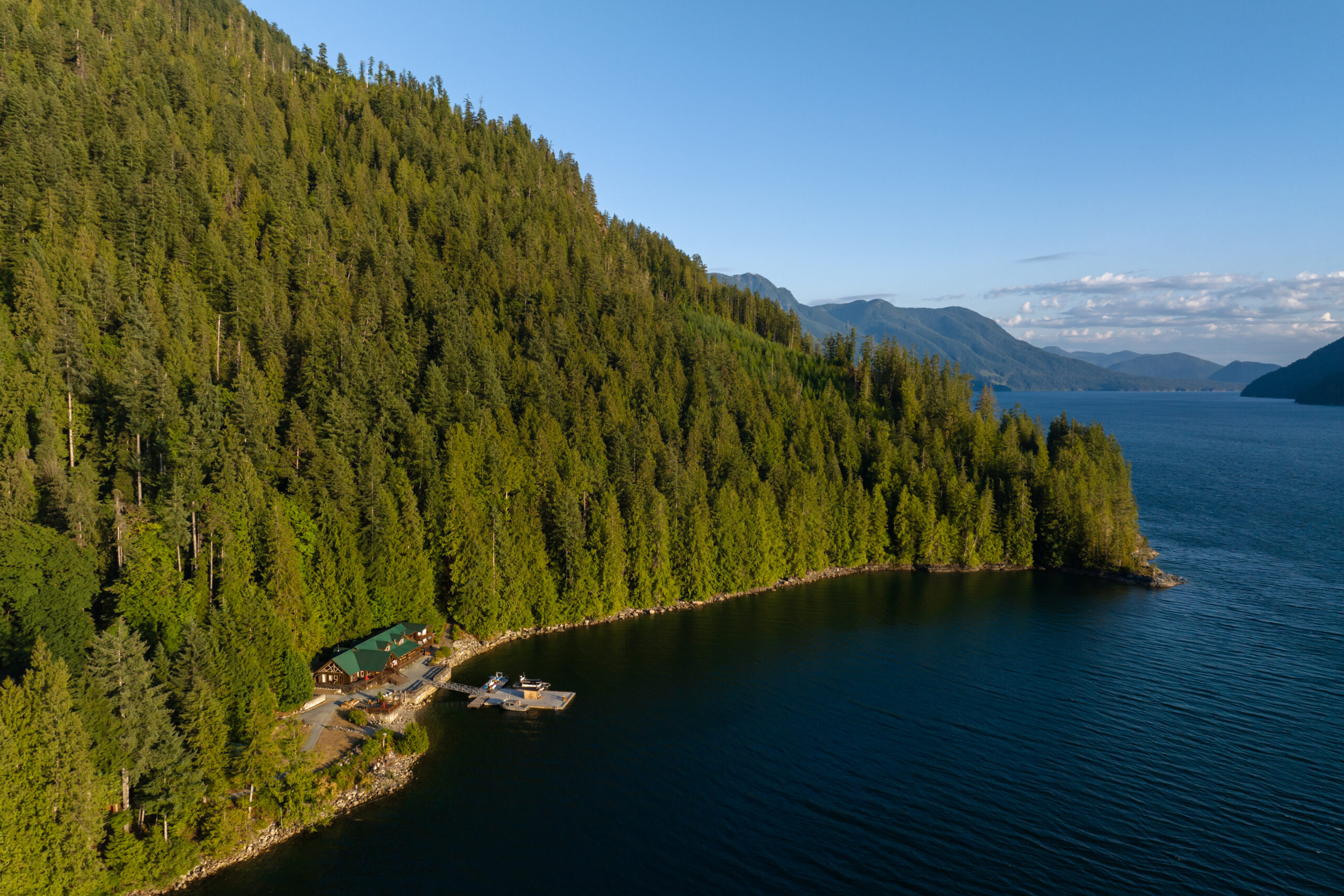 An overhead shot of an inlet in Desolation Sound, where a building is visible near the water.