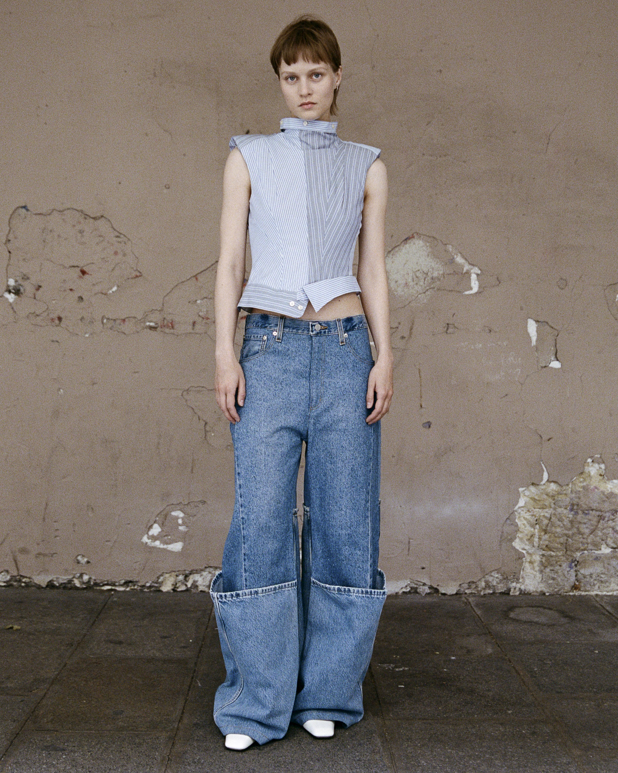 A woman wears clothes by Re-Pull, made from recycled fabrics, as part of our August wishlist.