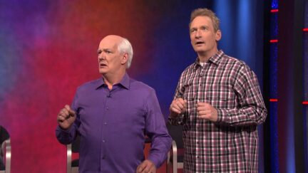 Two men, Colin Mochrie and Ryan Stiles, on stage together.