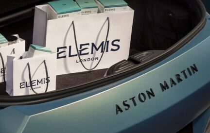 Elemis shopping bags in an Aston Martin car trunk.