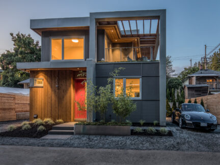 A shot at dusk of a two-storey laneway home.