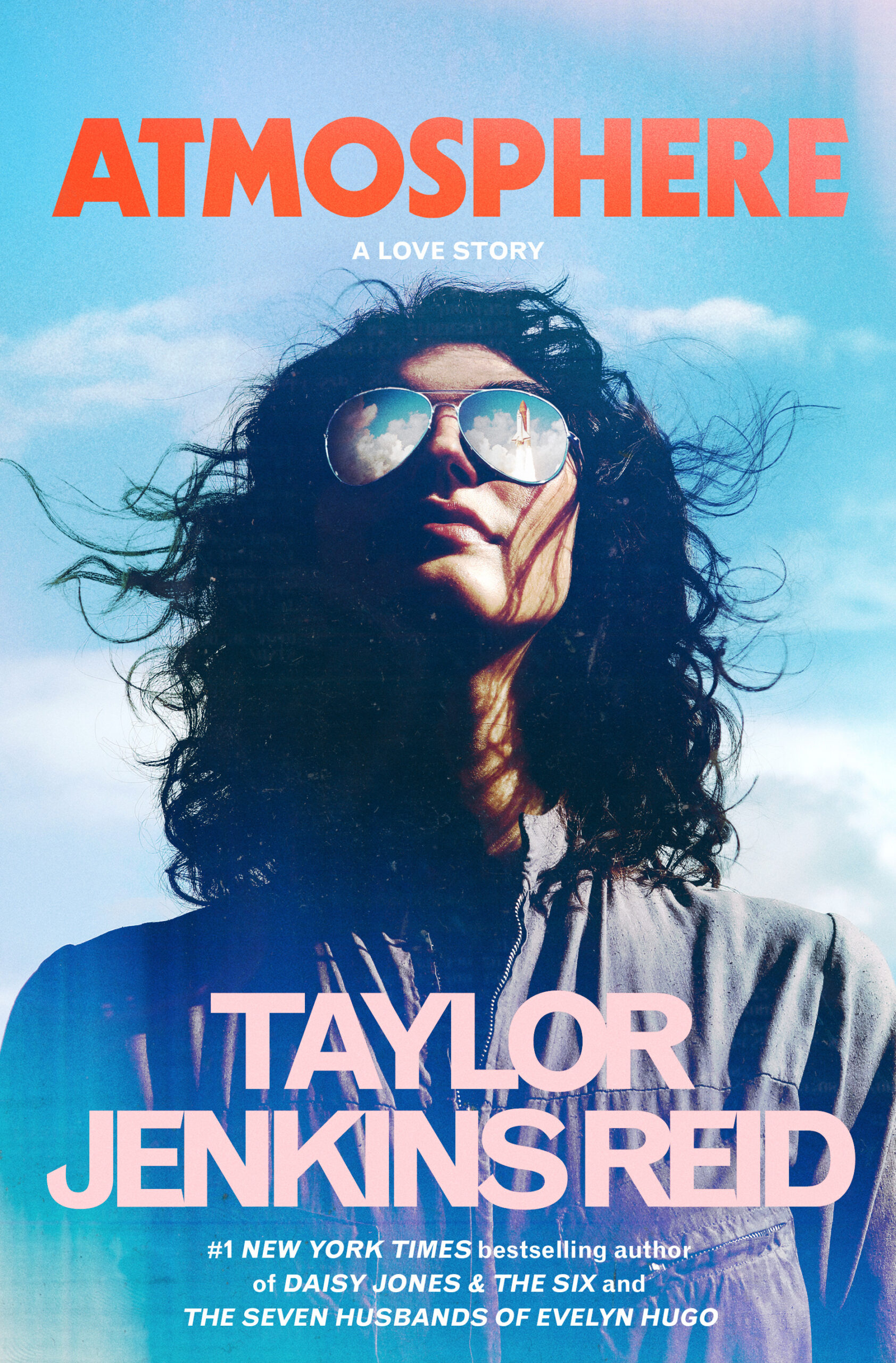 The cover artwork of Taylor Jenkins Reid's Atmosphere. A woman in aviator glasses gazes up, with the reflection of a space shuttle visible in her lenses.