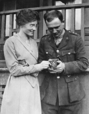 A man and woman hold hands.