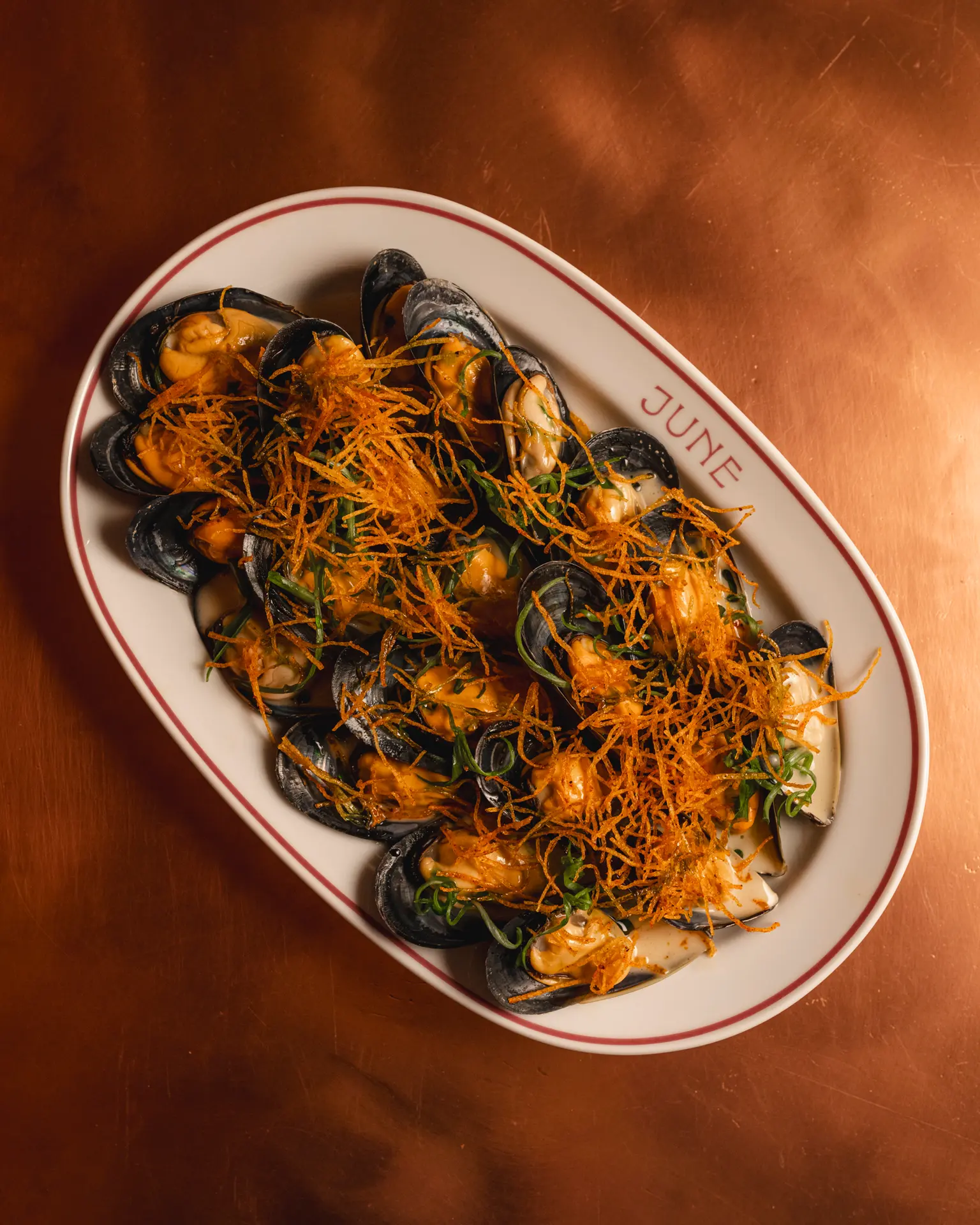 A plate of mussels, shot from above.