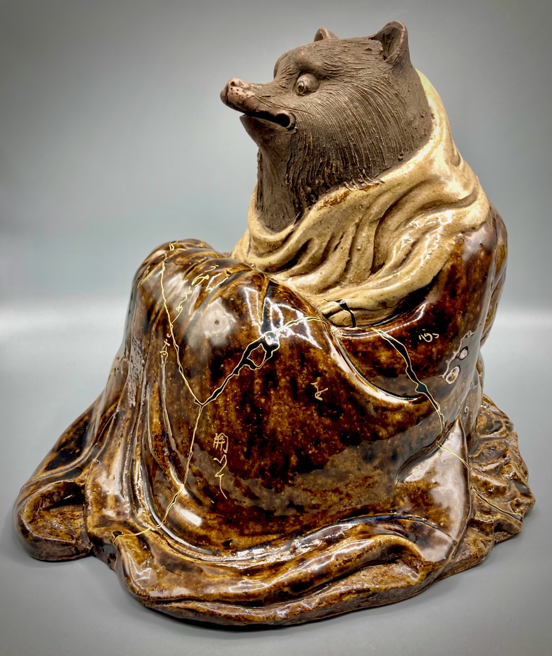 A sculpture of a tanuki, a Japanese bear, by Naoko Fukumaru.