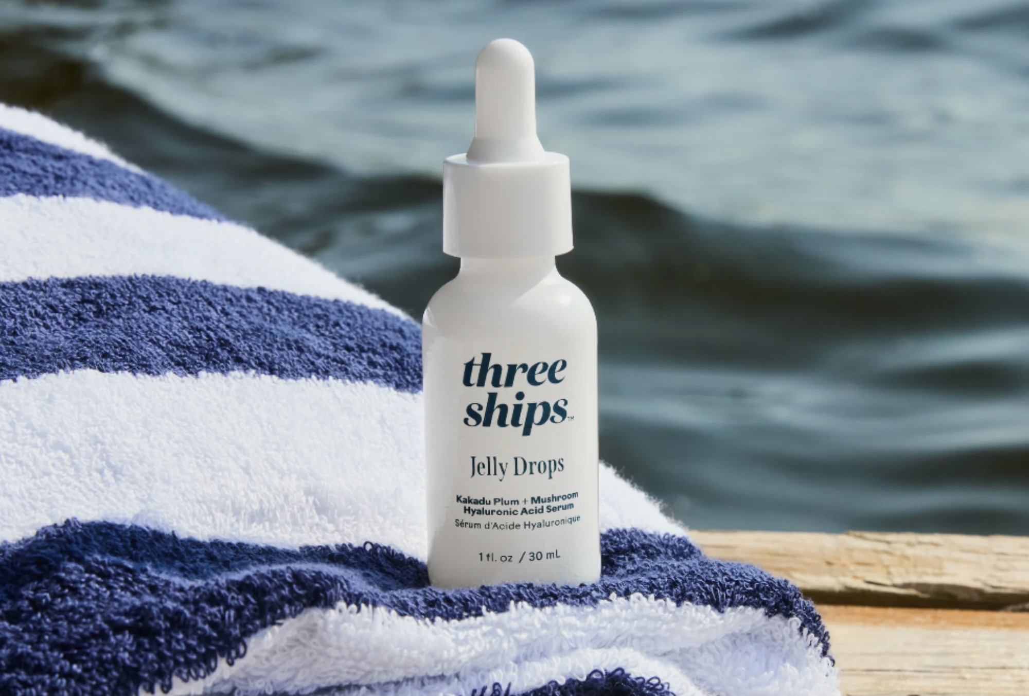 A Three Ships bottle of Jelly Drops on a beach towel - November wishlist.