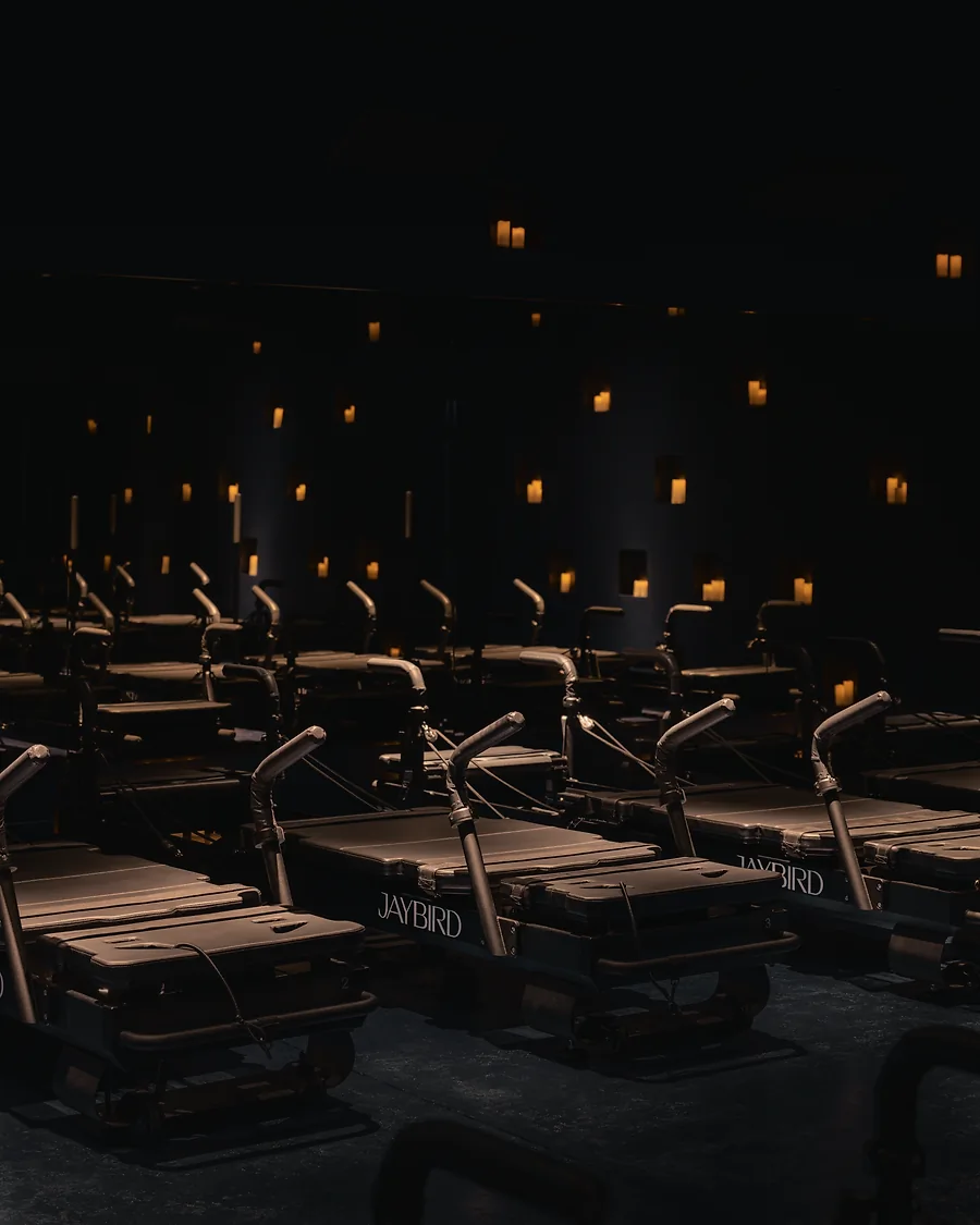 Treadmills in a dark room.