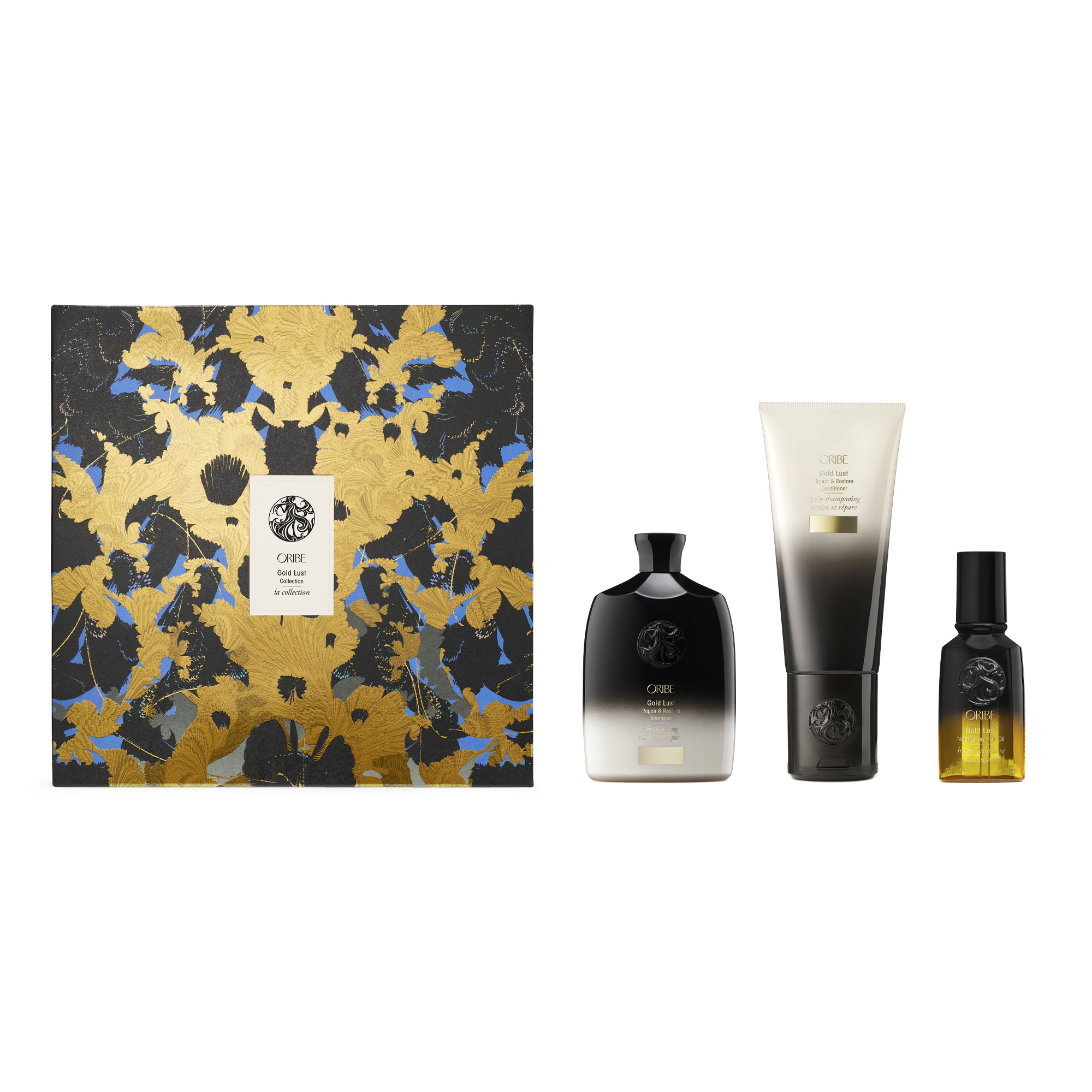 Bottles of beauty products next to a gold, black, and blue gift box. Luxury holiday wishlist