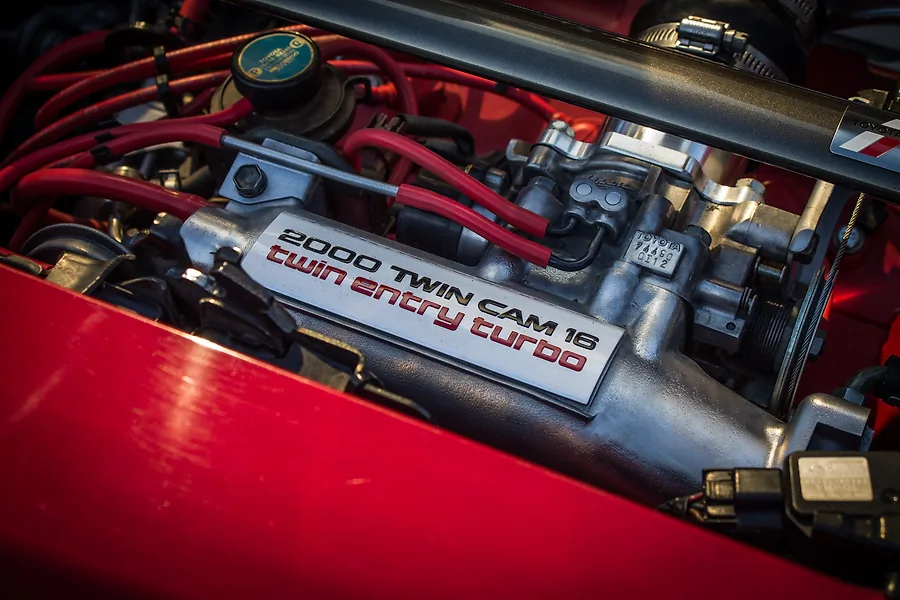 A close up of a car engine labelled "2000 Twin Cam 16 twin entry turbo."