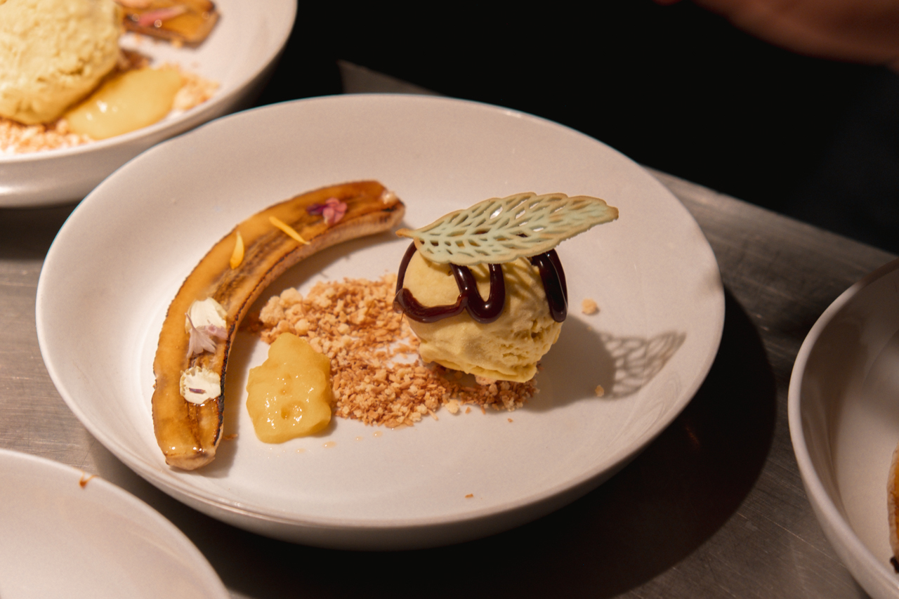 A plate of dessert with a banana.