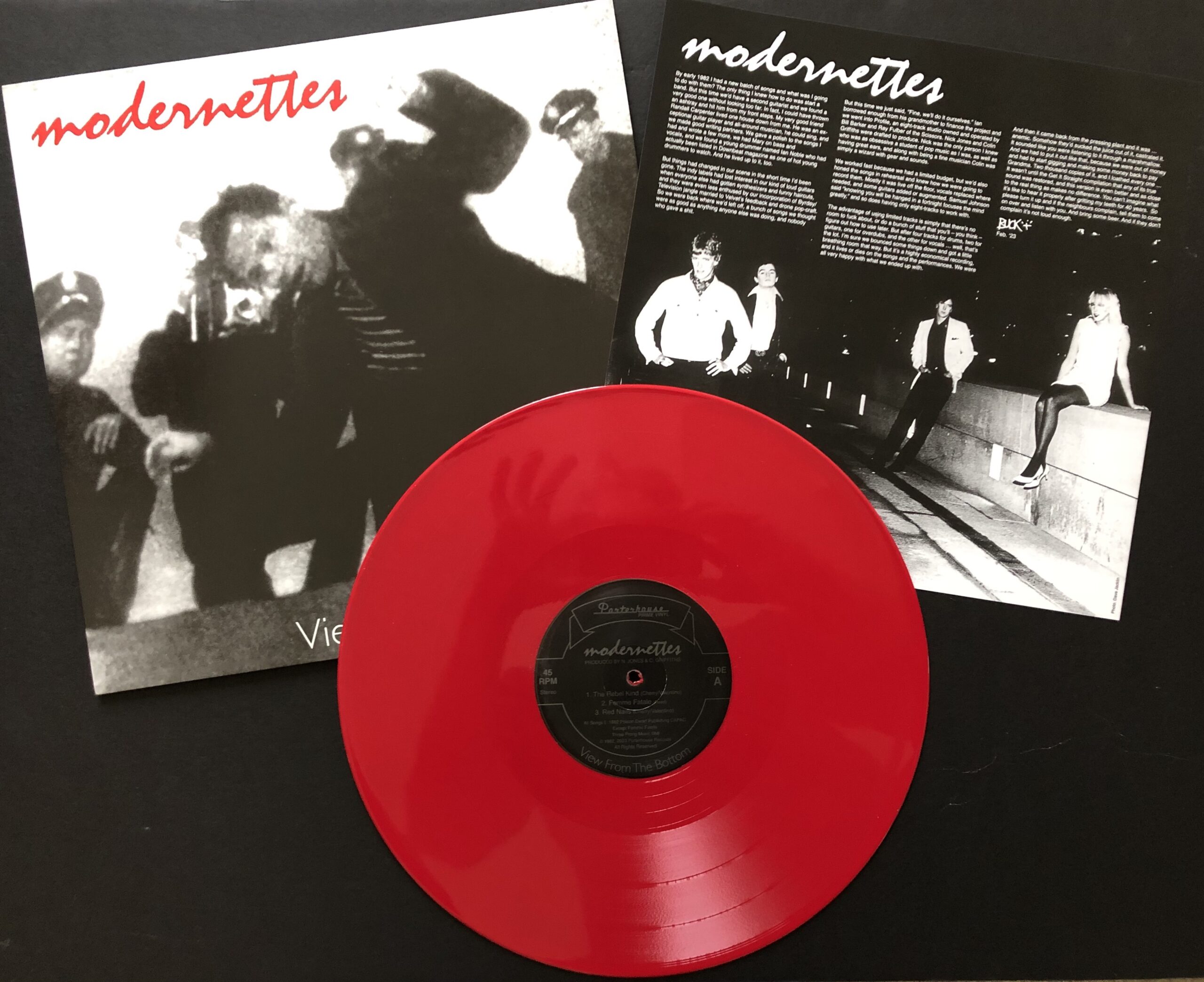 A record sleeve and bright red vinyl.