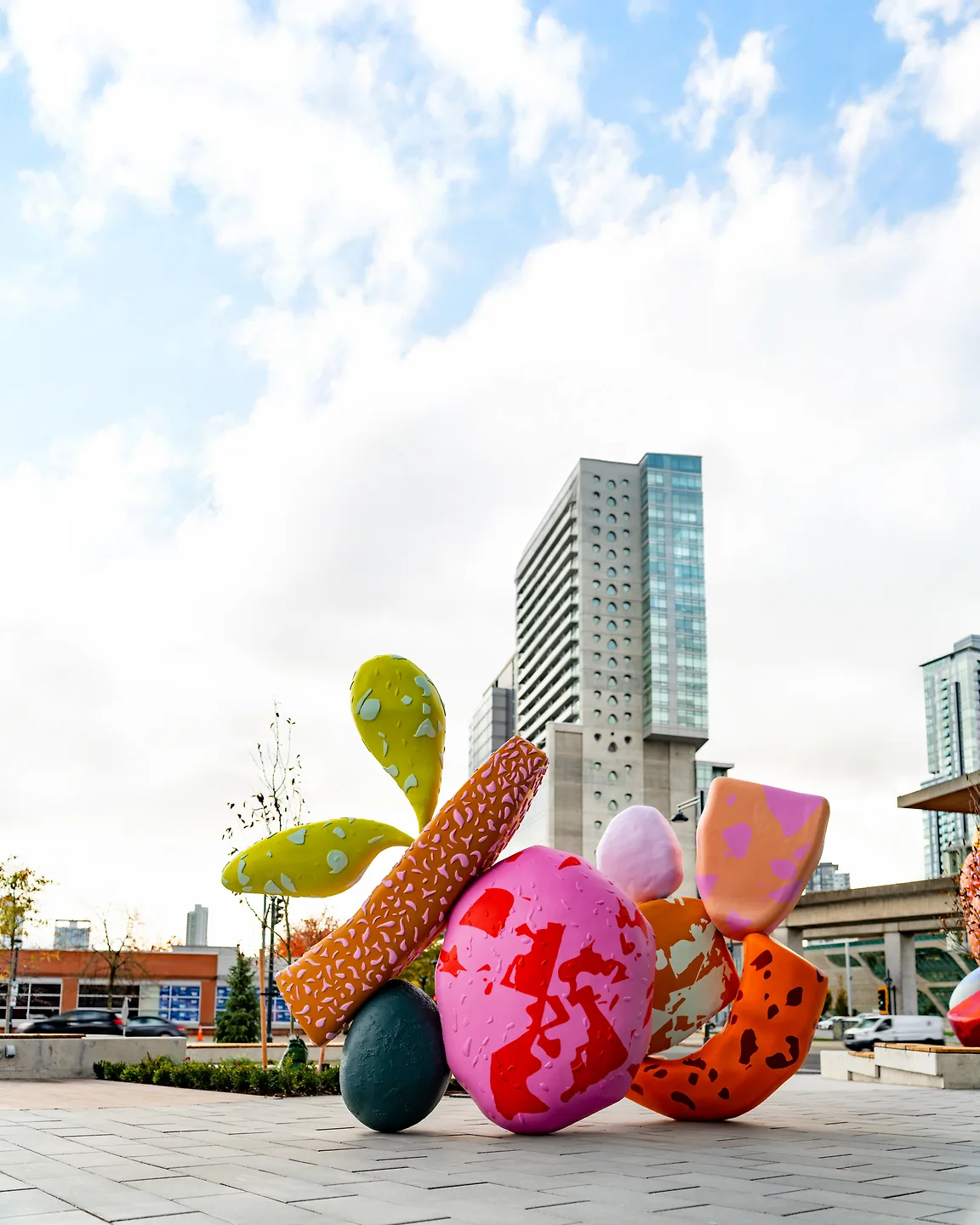 A multi-coloured statue outdoors as part of Sanctuaries of Belonging.