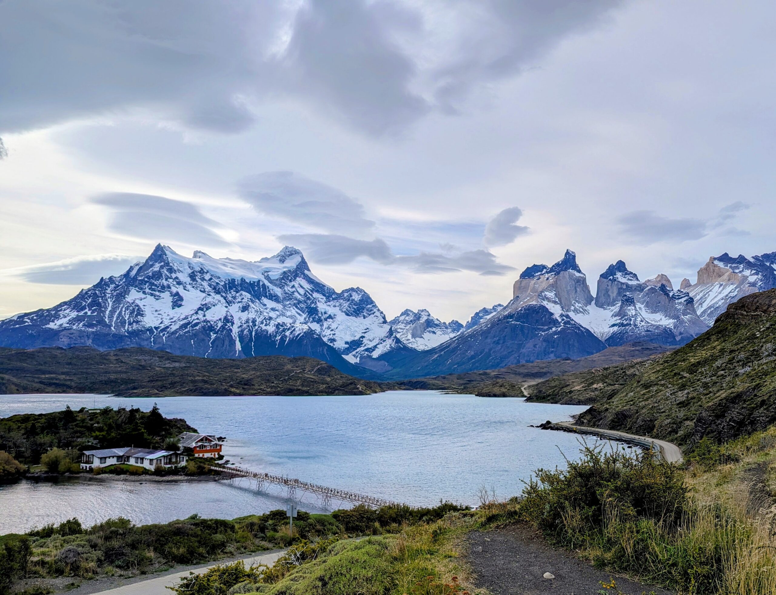 Mountains and a lake behind a group of cabins in Patagonia.